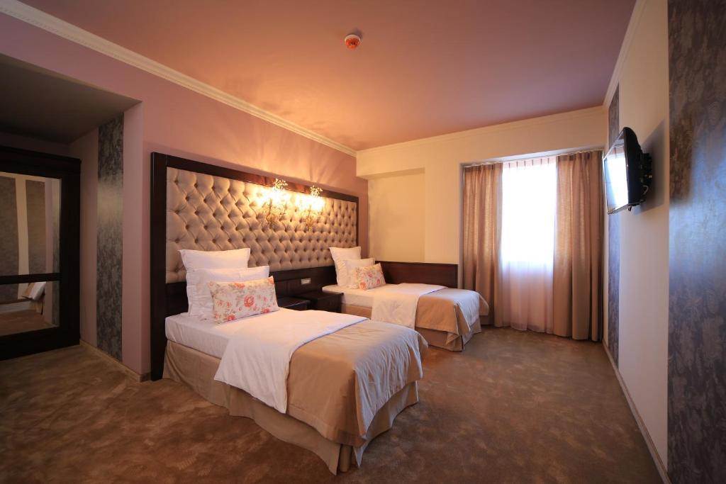Simfonia Boutique Hotel Рымнику-Вылча Номер фото